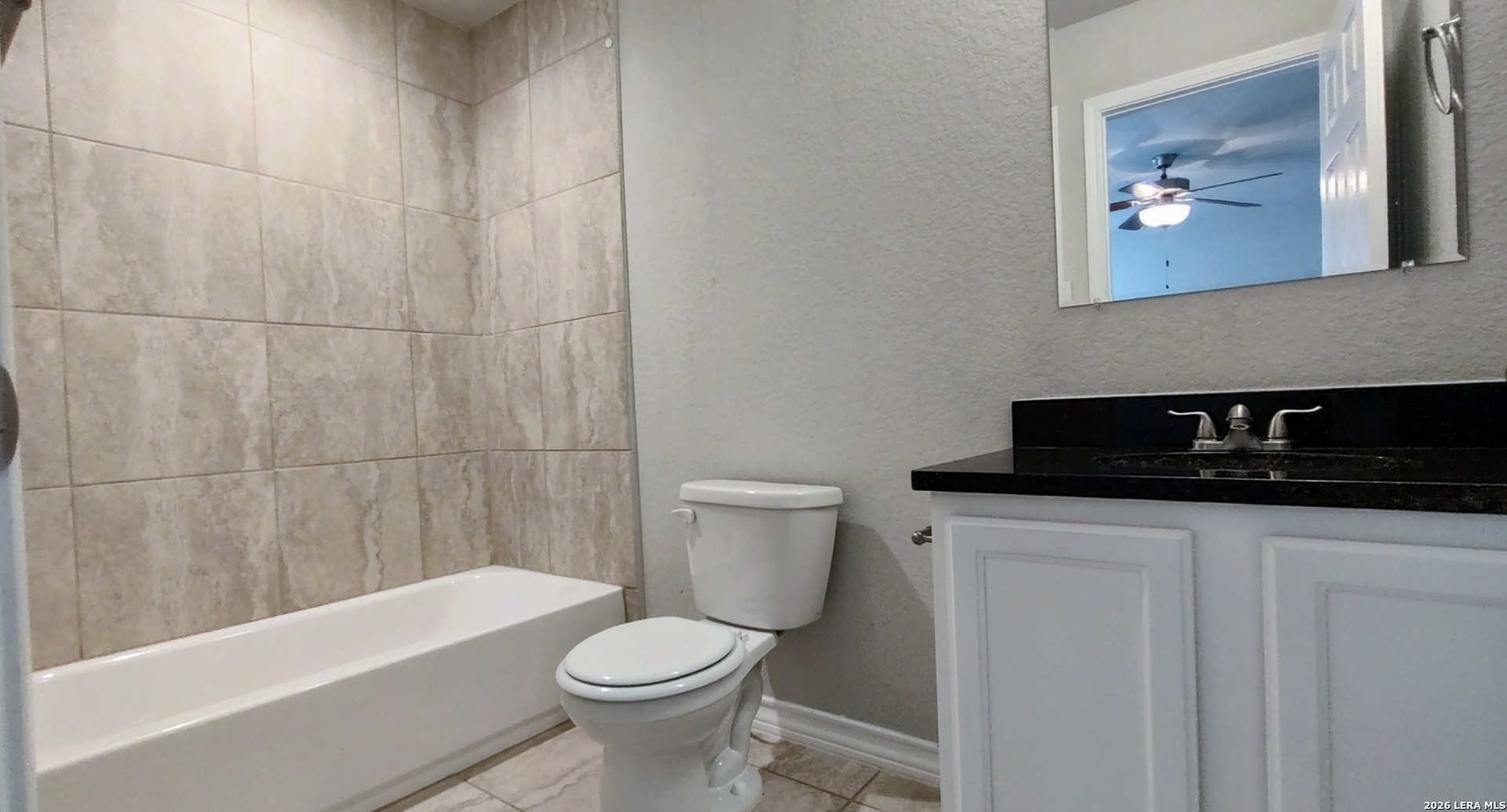 16901 Dancing Ava Selma, TX 78154 - Photo 8 of 14 a bathroom with a sink a toilet and a bathtub