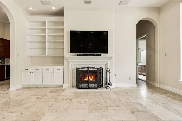 a bed room with a bed and a chair