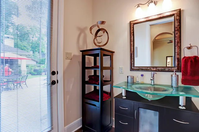 a view of a dining area with furniture window and a ceiling fan