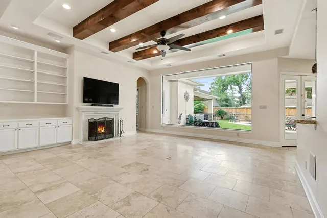a view of a livingroom with an empty space and a fireplace