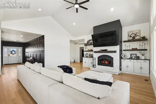 a living room with furniture and a flat screen tv