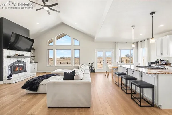 a living room with furniture fireplace and flat screen tv