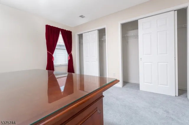 an entryway with wooden floor