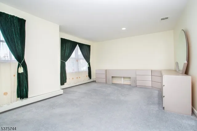 a view of livingroom with furniture and white walls