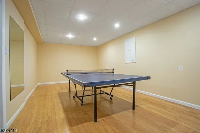 a view of a room with furniture and wooden floor
