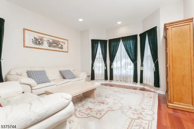 a large white bed in a white room