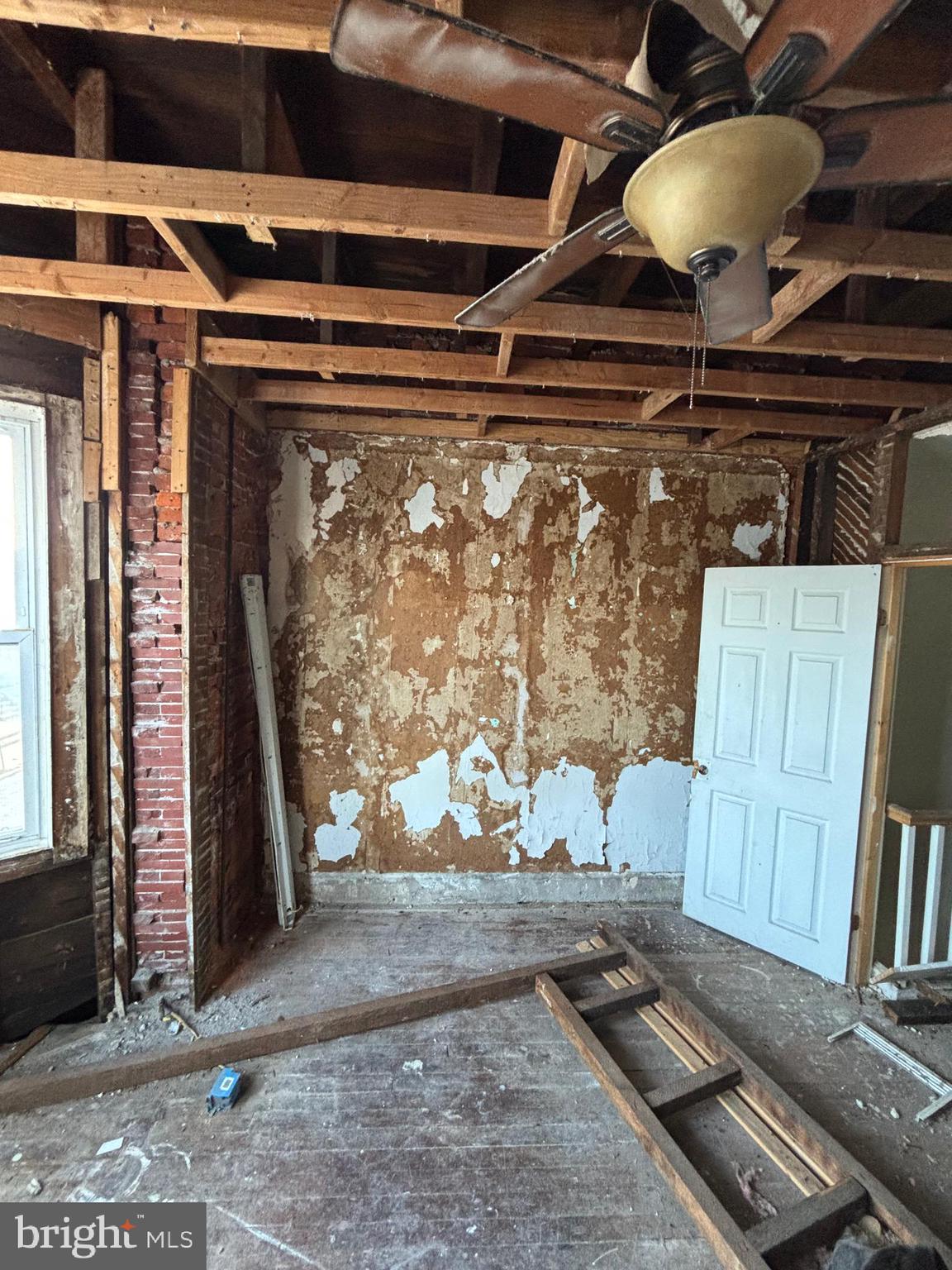 126 North Robinson Street Philadelphia, PA 19139 - Photo 2 of 4 a room with wooden floor
