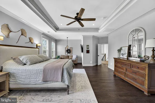 a bathroom with a toilet a sink and a mirror