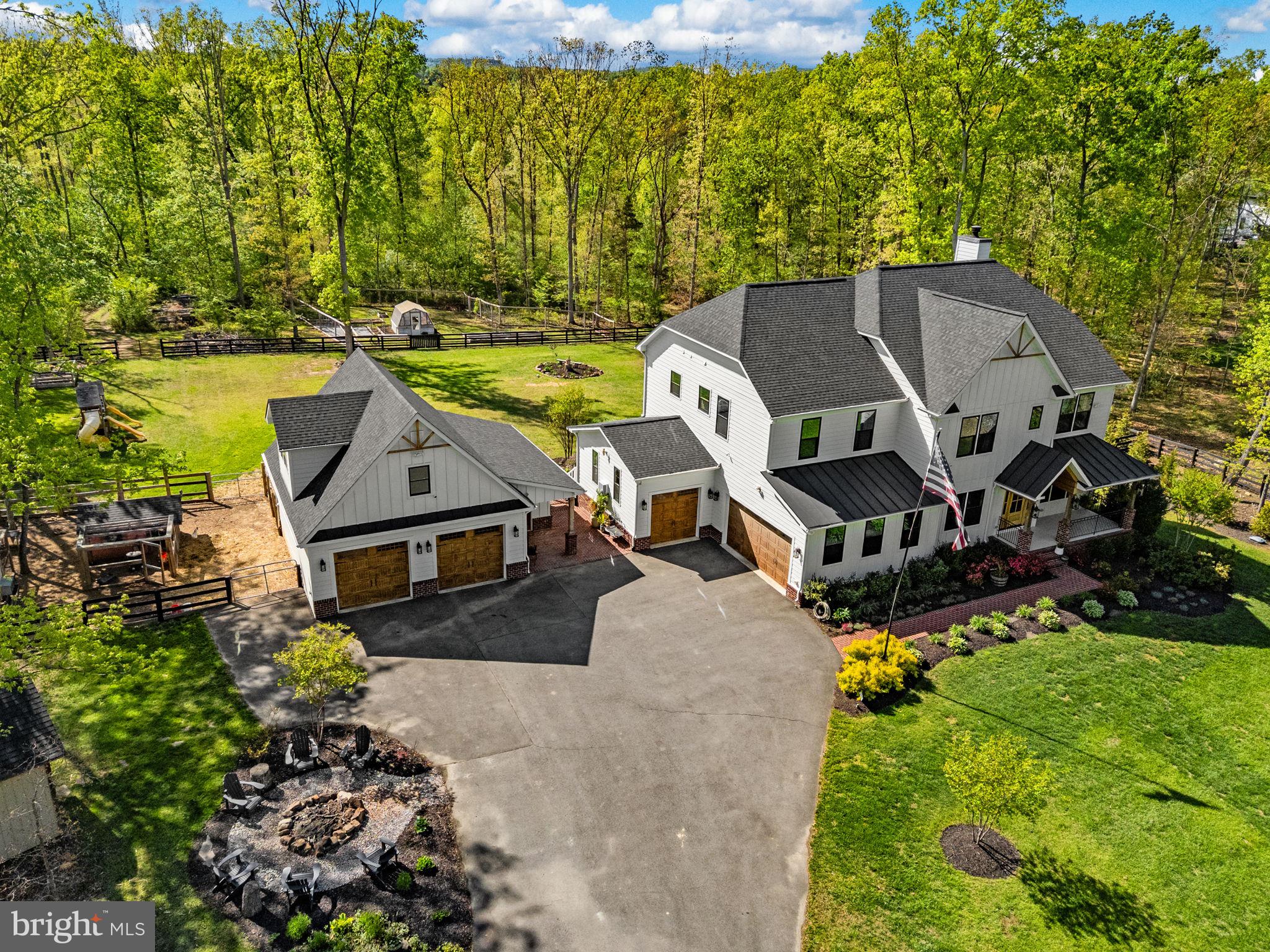 8794 Buckland Mill Road Gainesville, VA 20155 - Photo 3 of 67 Charming home nestled in lush greenery.