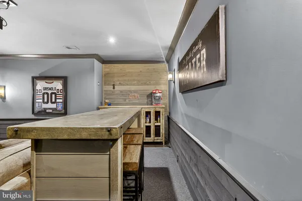 a living room with furniture flat screen tv and wooden floor