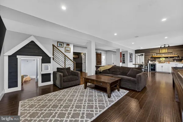 a view of a patio with table and chairs with wooden floor and fence