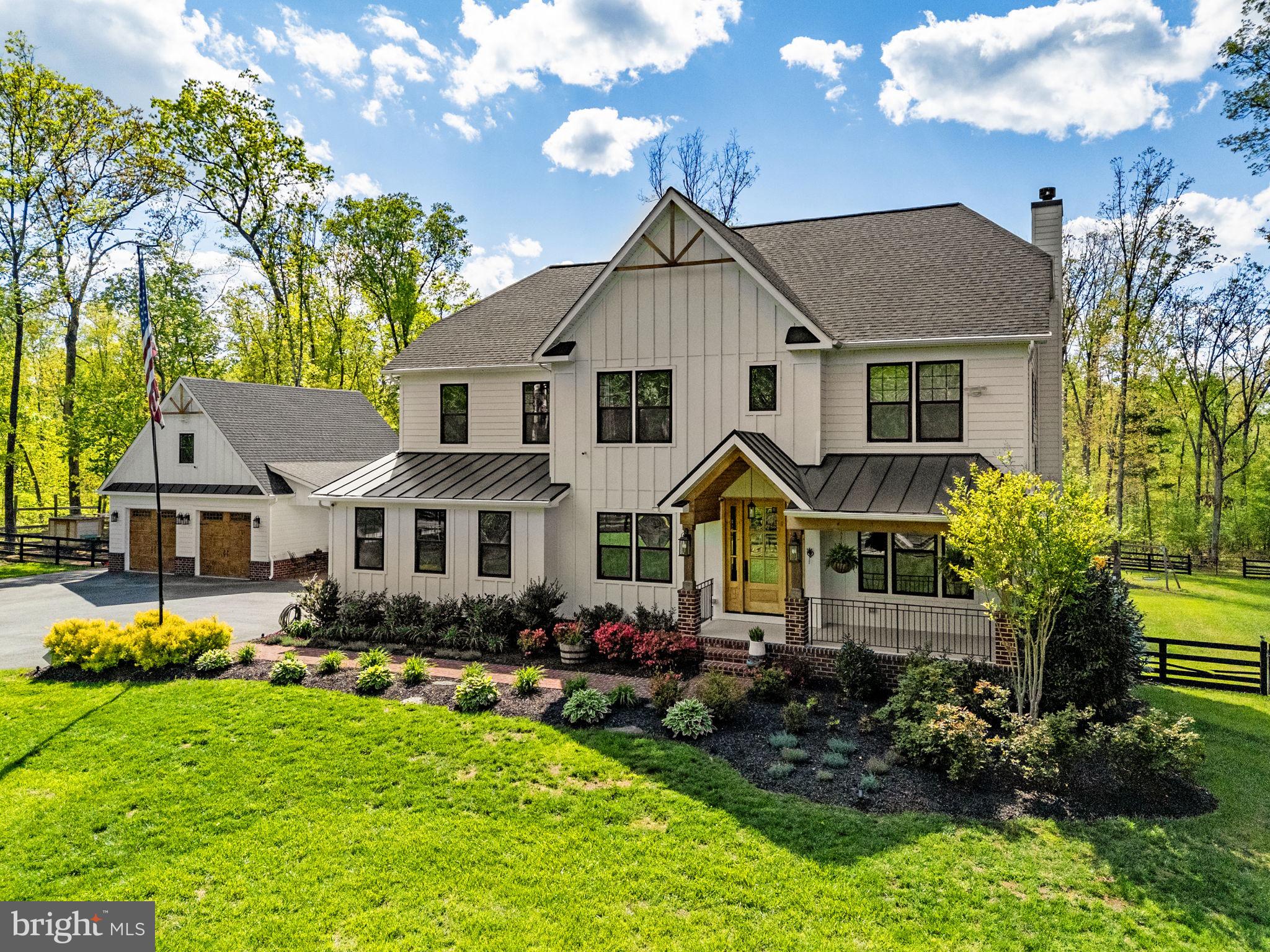 8794 Buckland Mill Road Gainesville, VA 20155 - Photo 5 of 67 Charming home nestled in lush greenery.