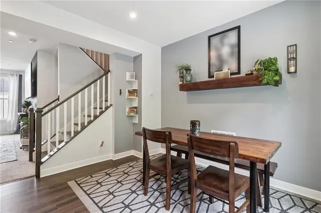 a view of a dining room with furniture and wooden floor