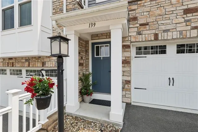 a view of a potted flower in front of a house