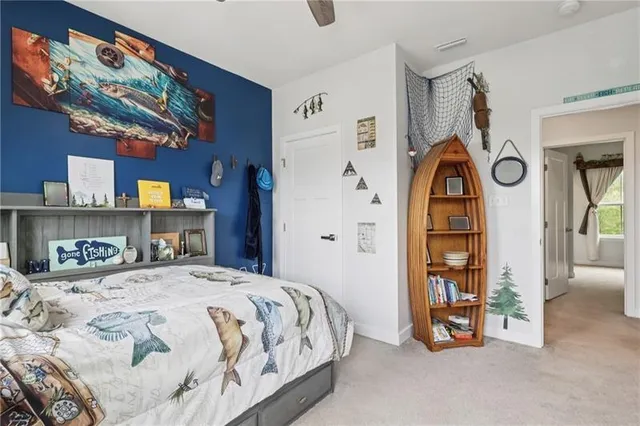 a bedroom with a bed a dresser and book shelf