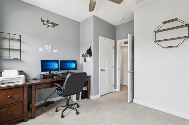 a view of a workspace with furniture