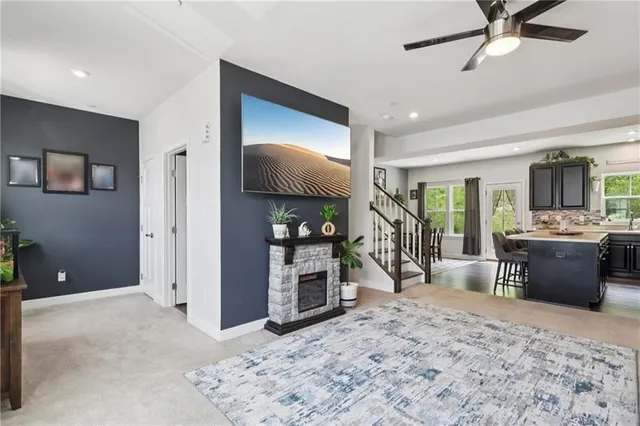 a view of a livingroom with furniture and a flat screen tv