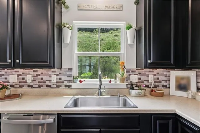 a kitchen with a sink and a window