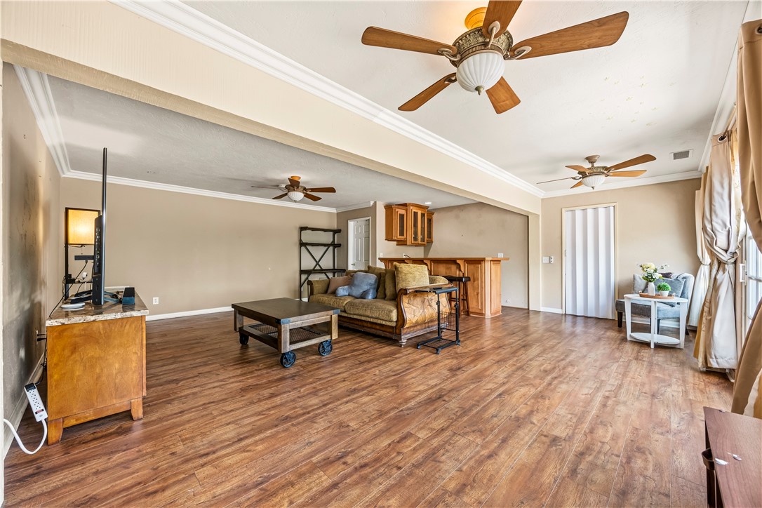 1485 Vía Ladera Fallbrook, CA 92028 - Photo 31 of 43 a living room with furniture and a wooden floor