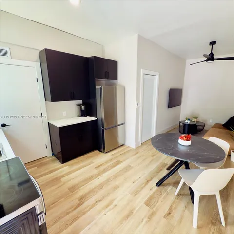 a bedroom with a bed and a table in it