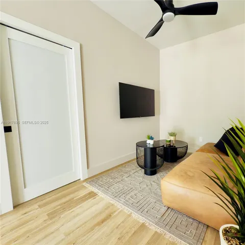 a bedroom with a bed and flat screen tv