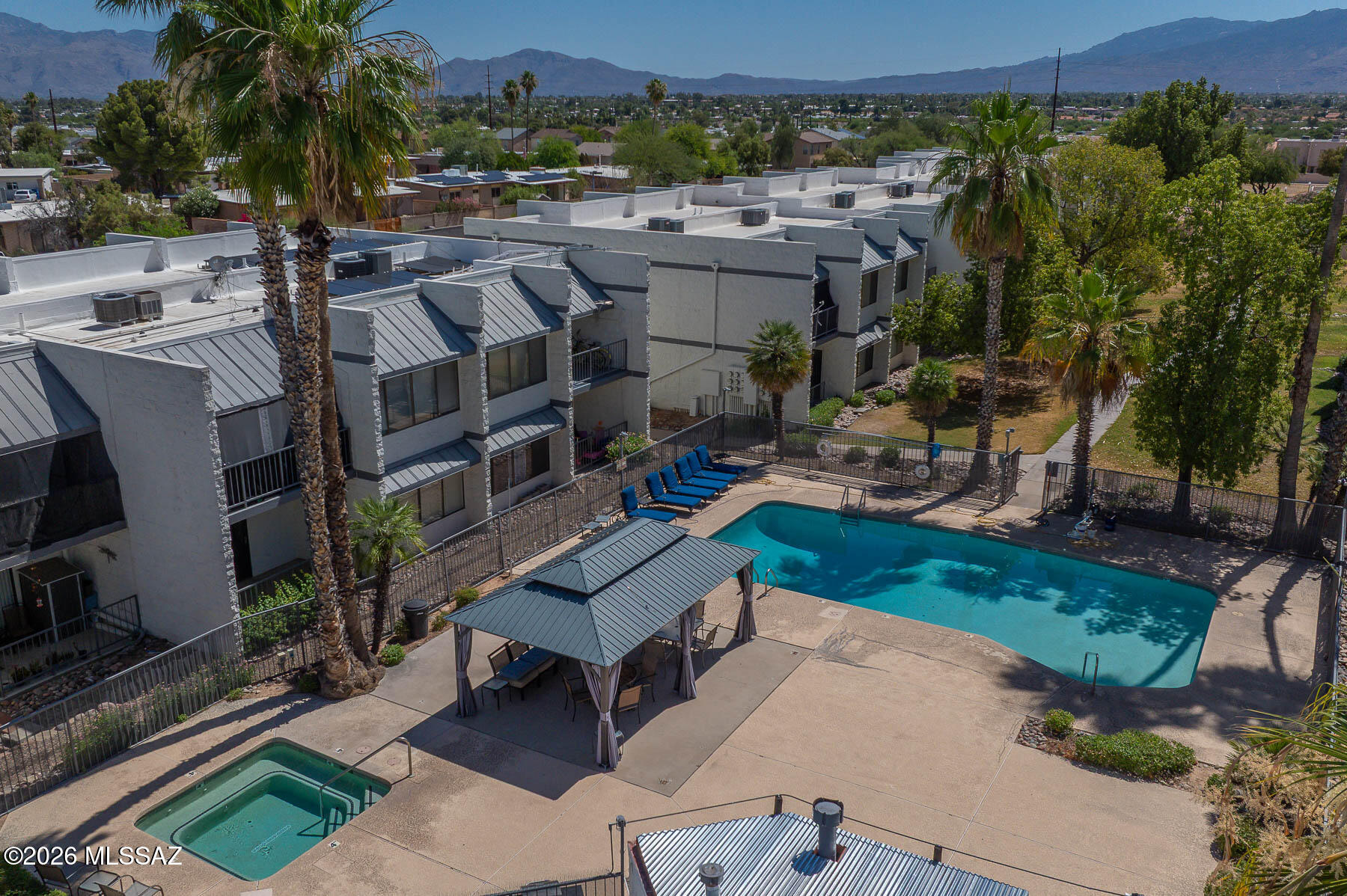 7777 East Golf Links Road, Unit 2308 Tucson, AZ 85730 - Photo 8 of 37 an aerial view of multiple houses with a yard