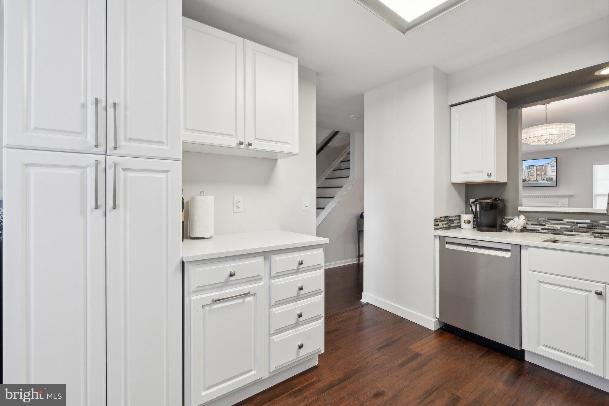410 McDaniel Drive Purcellville, VA 20132 - Photo 11 of 36 a kitchen with white cabinets and white appliances