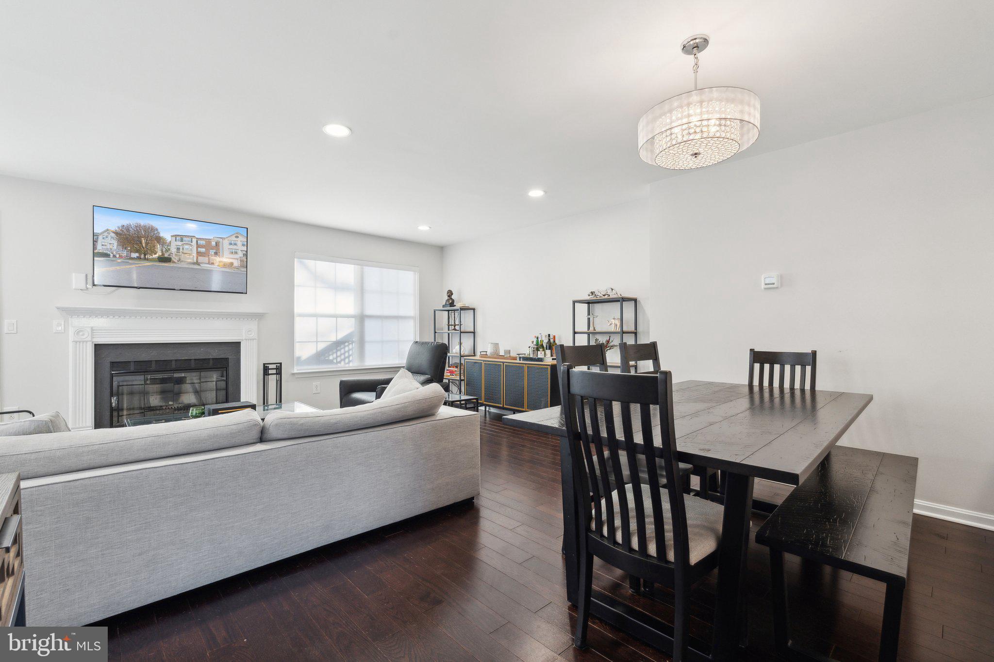410 McDaniel Drive Purcellville, VA 20132 - Photo 13 of 36 a living room with furniture dining table and a fireplace