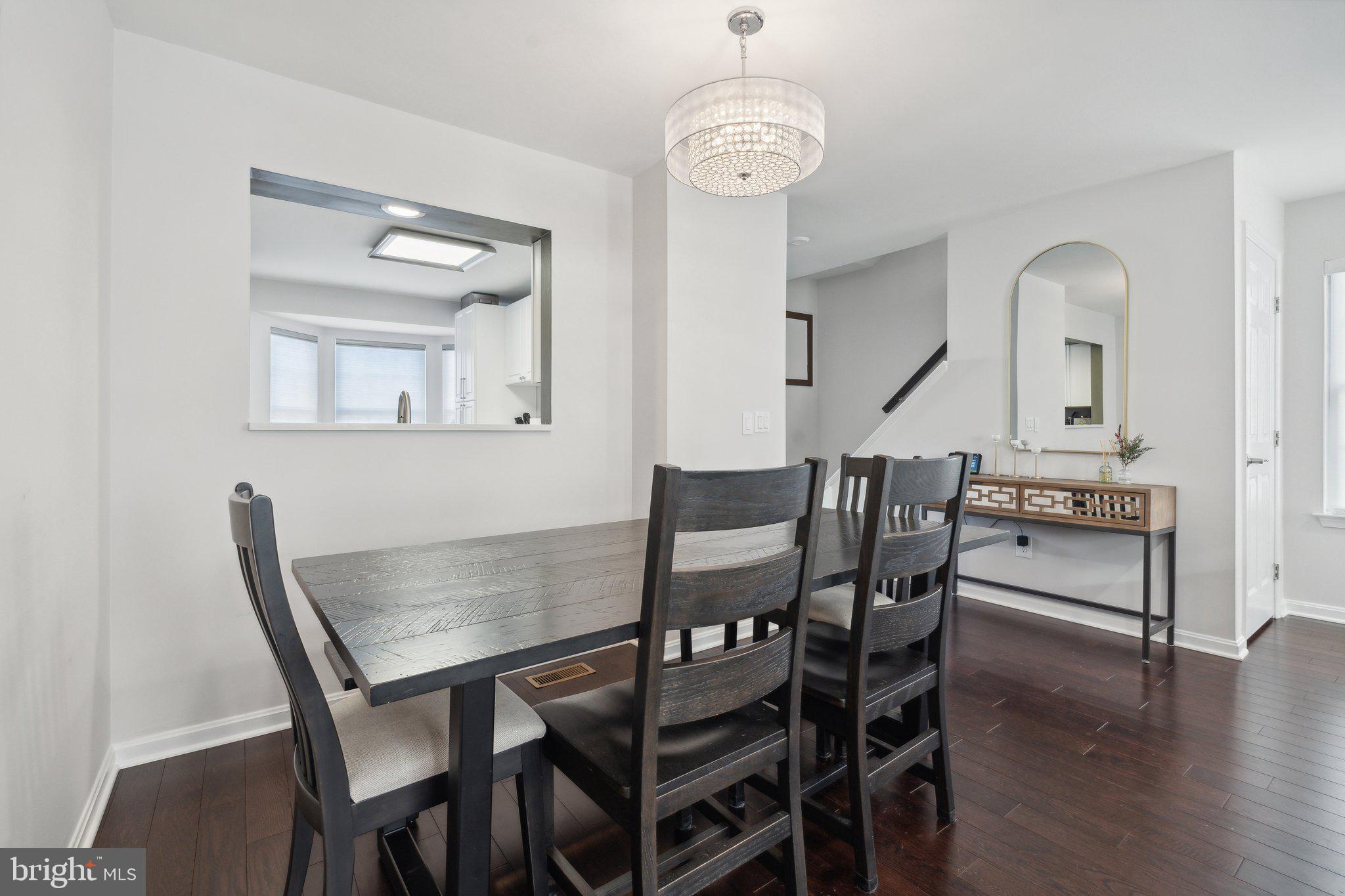 410 McDaniel Drive Purcellville, VA 20132 - Photo 14 of 36 a view of a dining room with furniture wooden floor and chandelier