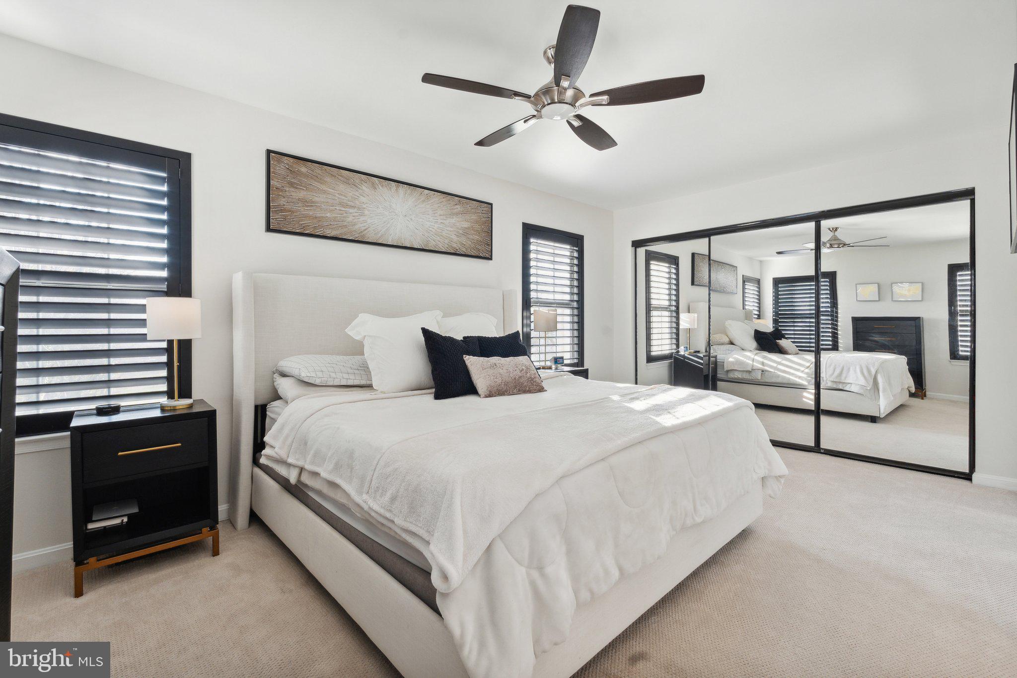 410 McDaniel Drive Purcellville, VA 20132 - Photo 21 of 36 a bedroom with bed and a chandelier