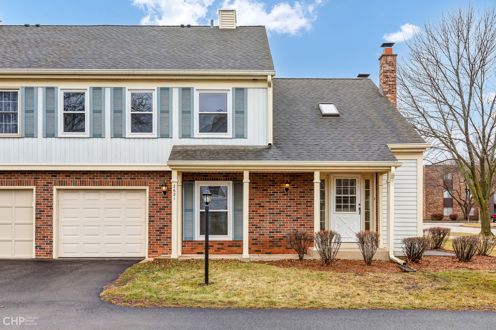 2621 College Hill Circle, Unit 63 Schaumburg, IL 60173 - Photo 1 of 21 a front view of a house with a yard