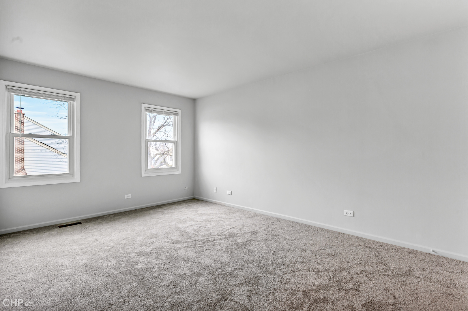 2621 College Hill Circle, Unit 63 Schaumburg, IL 60173 - Photo 13 of 21 an empty room with windows