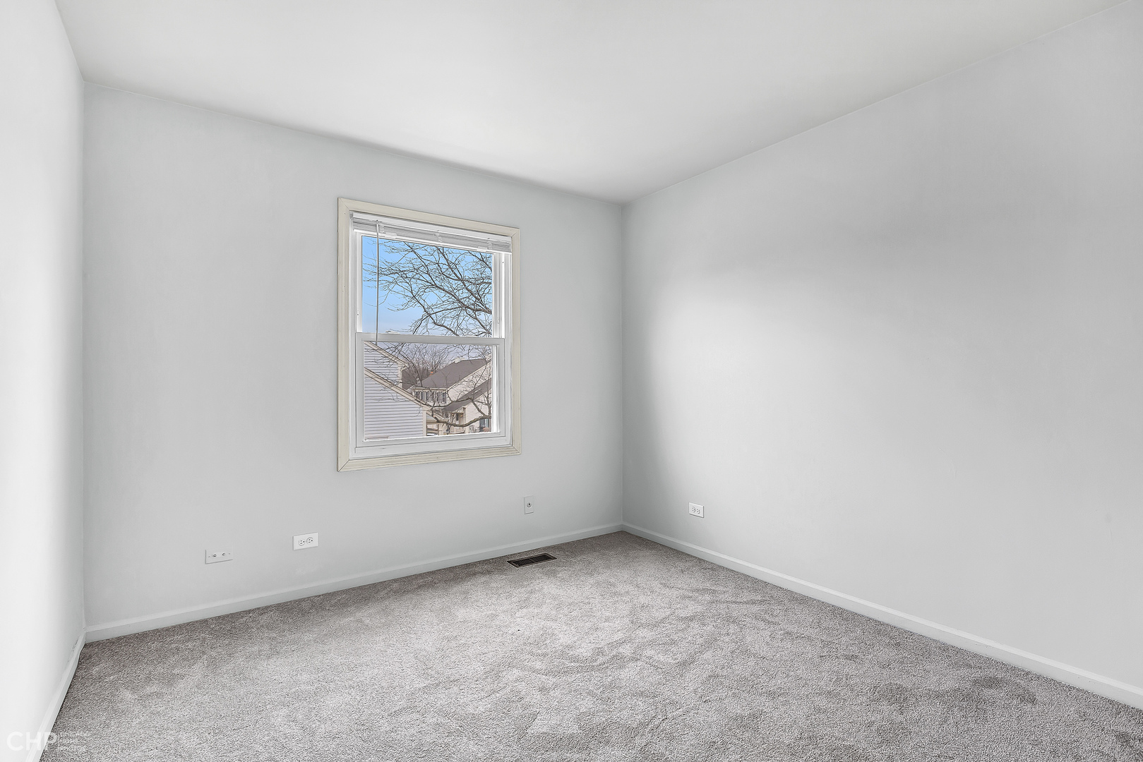 2621 College Hill Circle, Unit 63 Schaumburg, IL 60173 - Photo 16 of 21 an empty room with a window