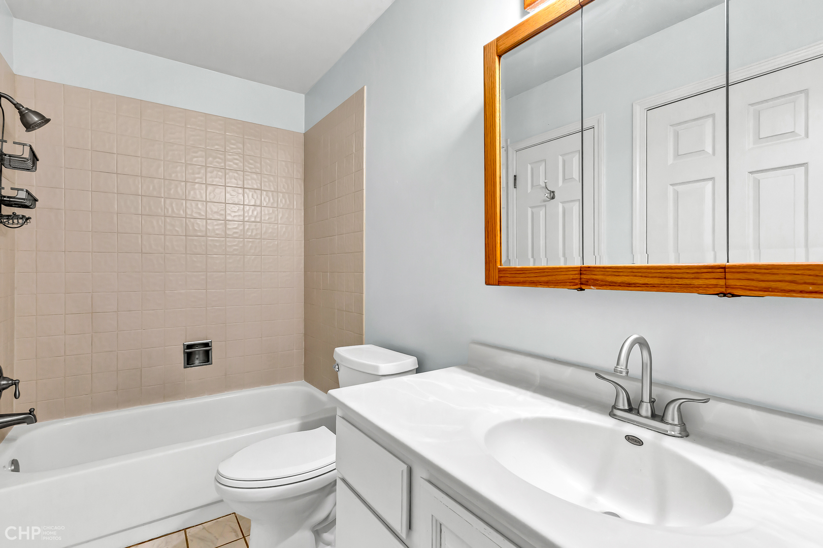 2621 College Hill Circle, Unit 63 Schaumburg, IL 60173 - Photo 18 of 21 a bathroom with a sink a toilet and shower