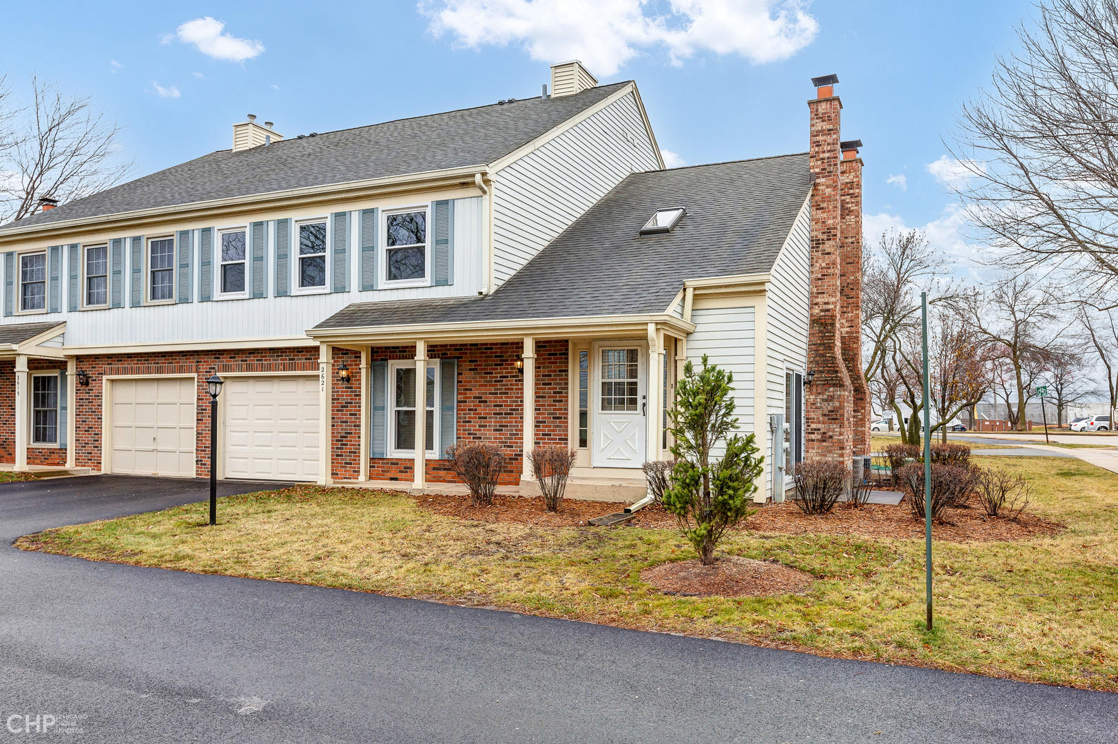 2621 College Hill Circle, Unit 63 Schaumburg, IL 60173 - Photo 20 of 21 a front view of a house with a yard