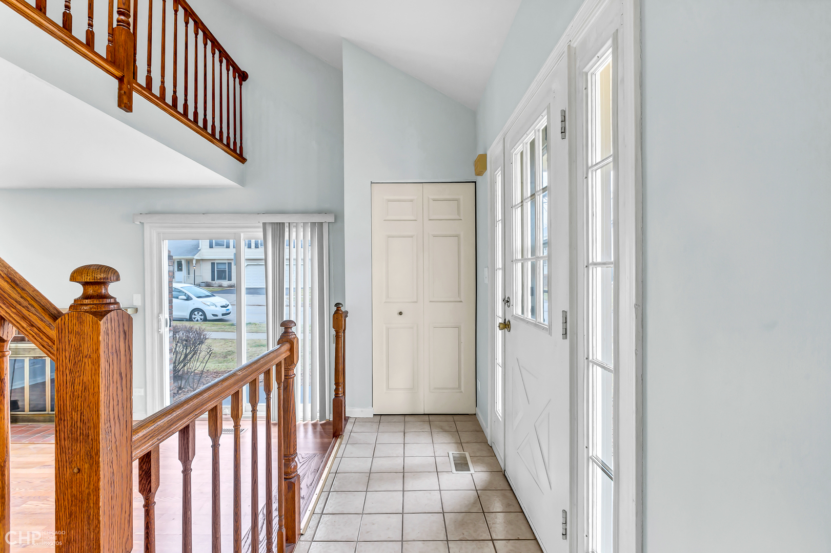 2621 College Hill Circle, Unit 63 Schaumburg, IL 60173 - Photo 2 of 21 a view of a hallway with wooden floor and staircase
