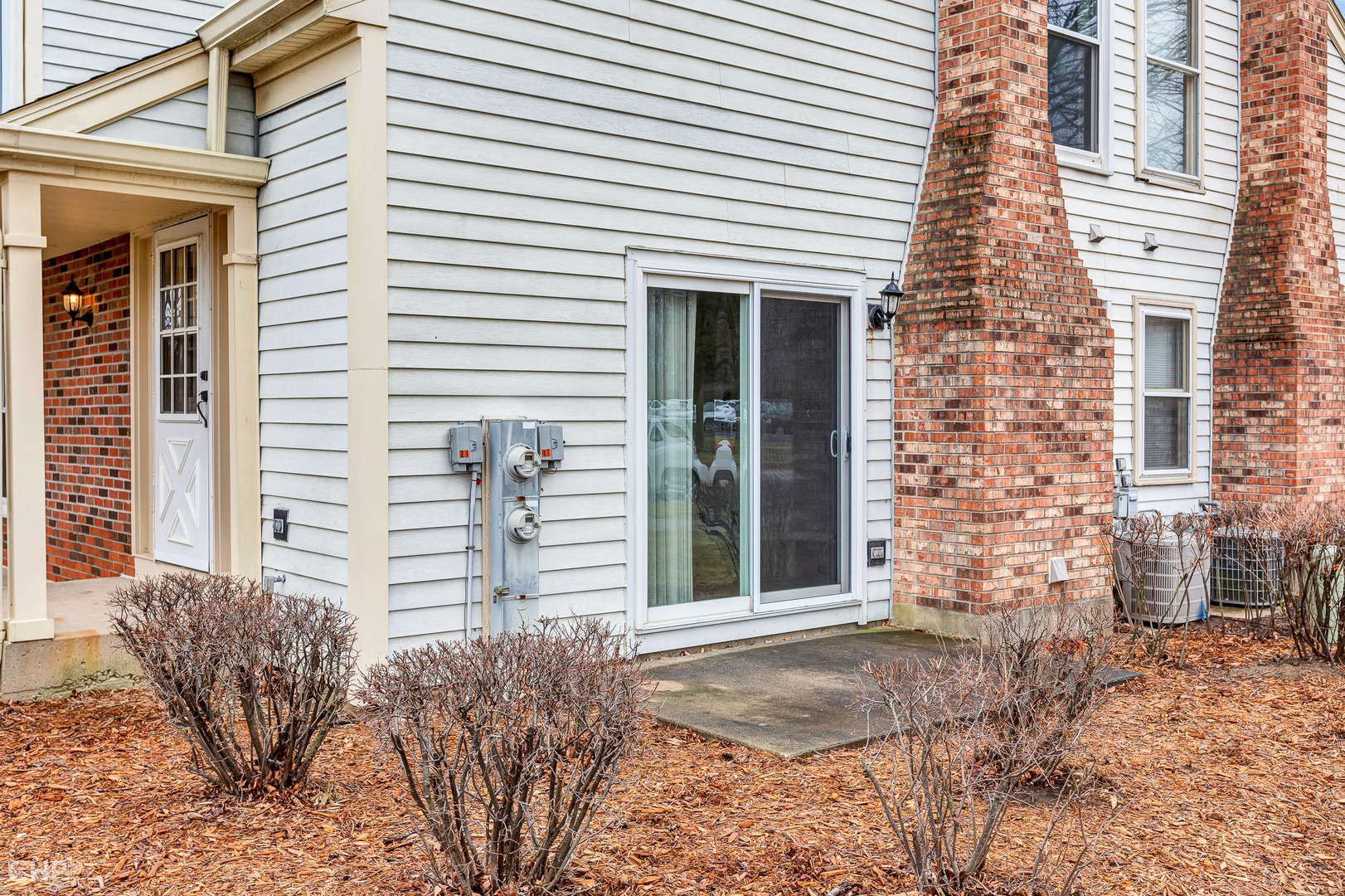 2621 College Hill Circle, Unit 63 Schaumburg, IL 60173 - Photo 21 of 21 a front view of a house with a yard