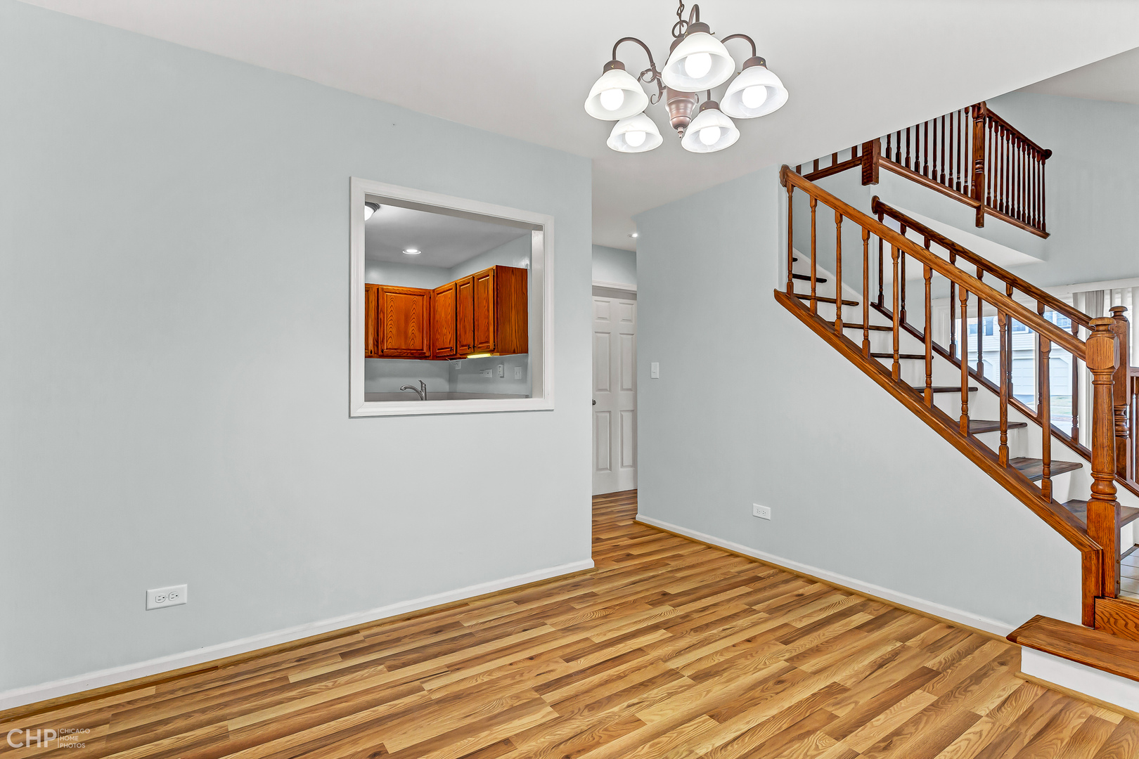 2621 College Hill Circle, Unit 63 Schaumburg, IL 60173 - Photo 5 of 21 a view of an empty room with wooden floor