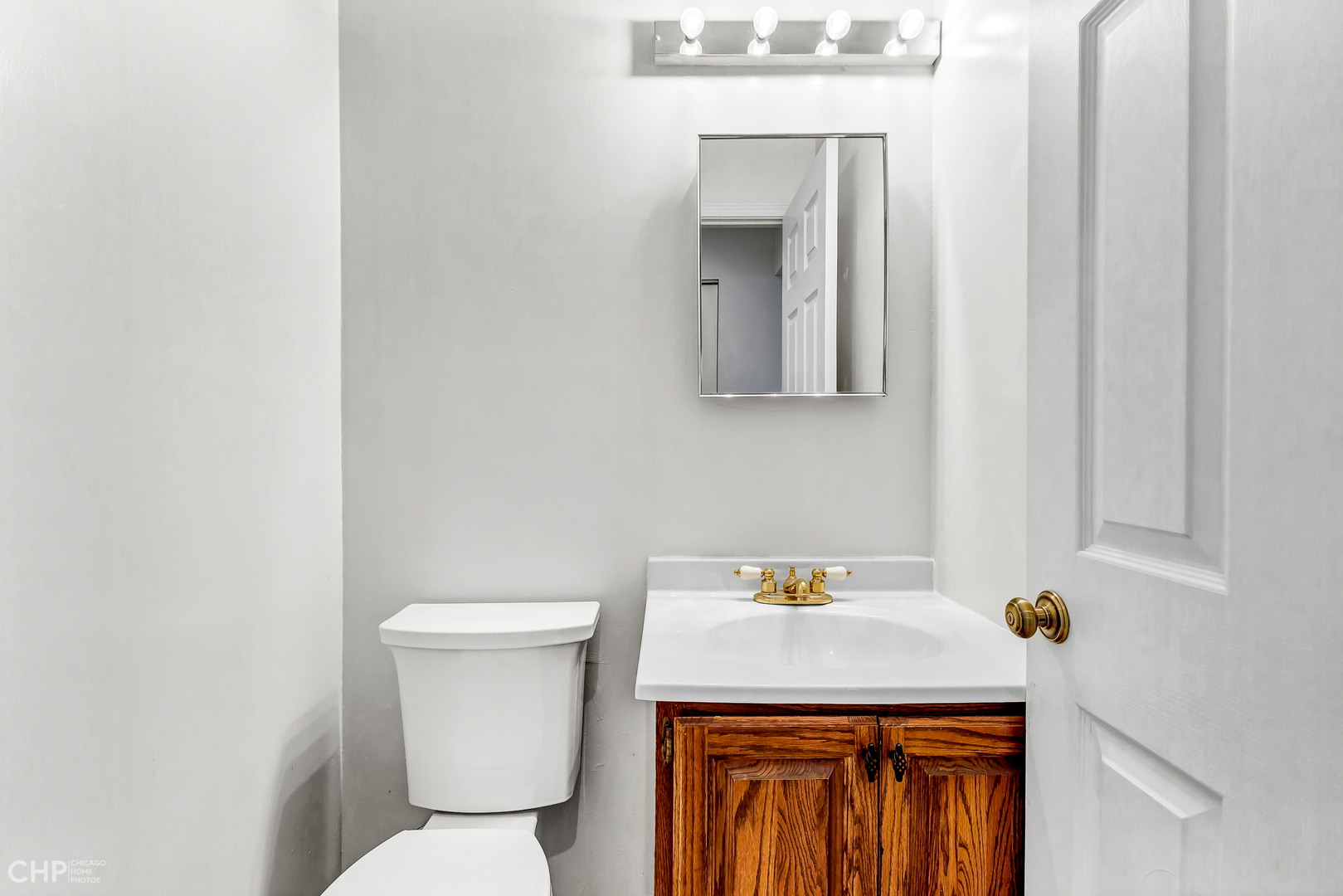 2621 College Hill Circle, Unit 63 Schaumburg, IL 60173 - Photo 10 of 21 a bathroom with a sink a toilet and mirror