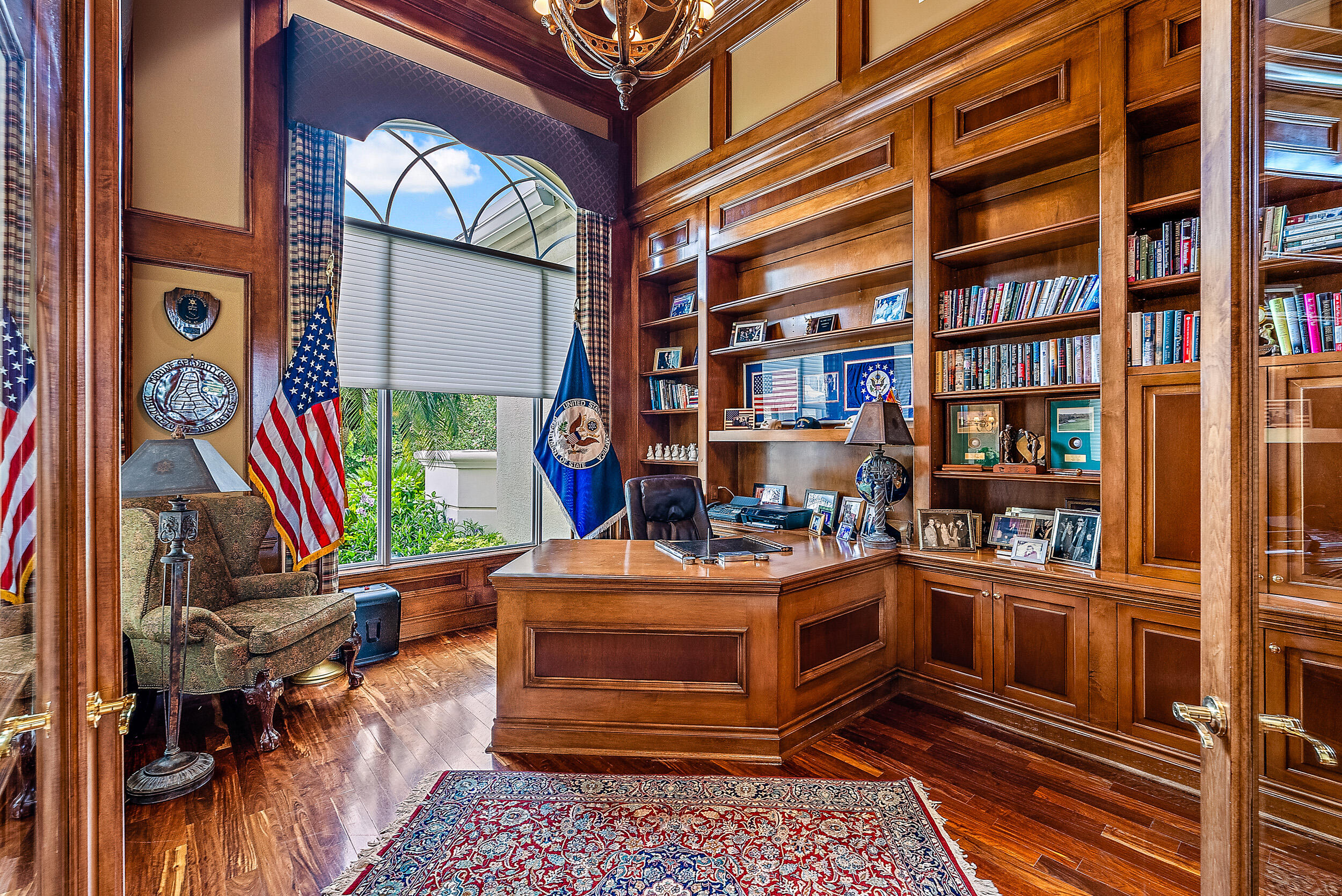 12049 Intercoastal Terrace Jupiter, FL 33469 - Photo 20 of 56 a room with furniture and a book shelf