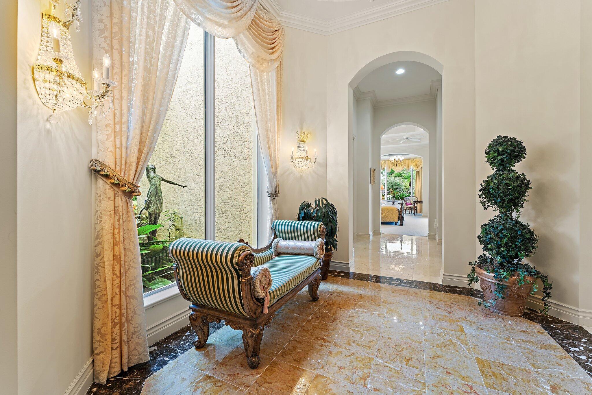 12049 Intercoastal Terrace Jupiter, FL 33469 - Photo 22 of 56 a living room with furniture and a potted plant