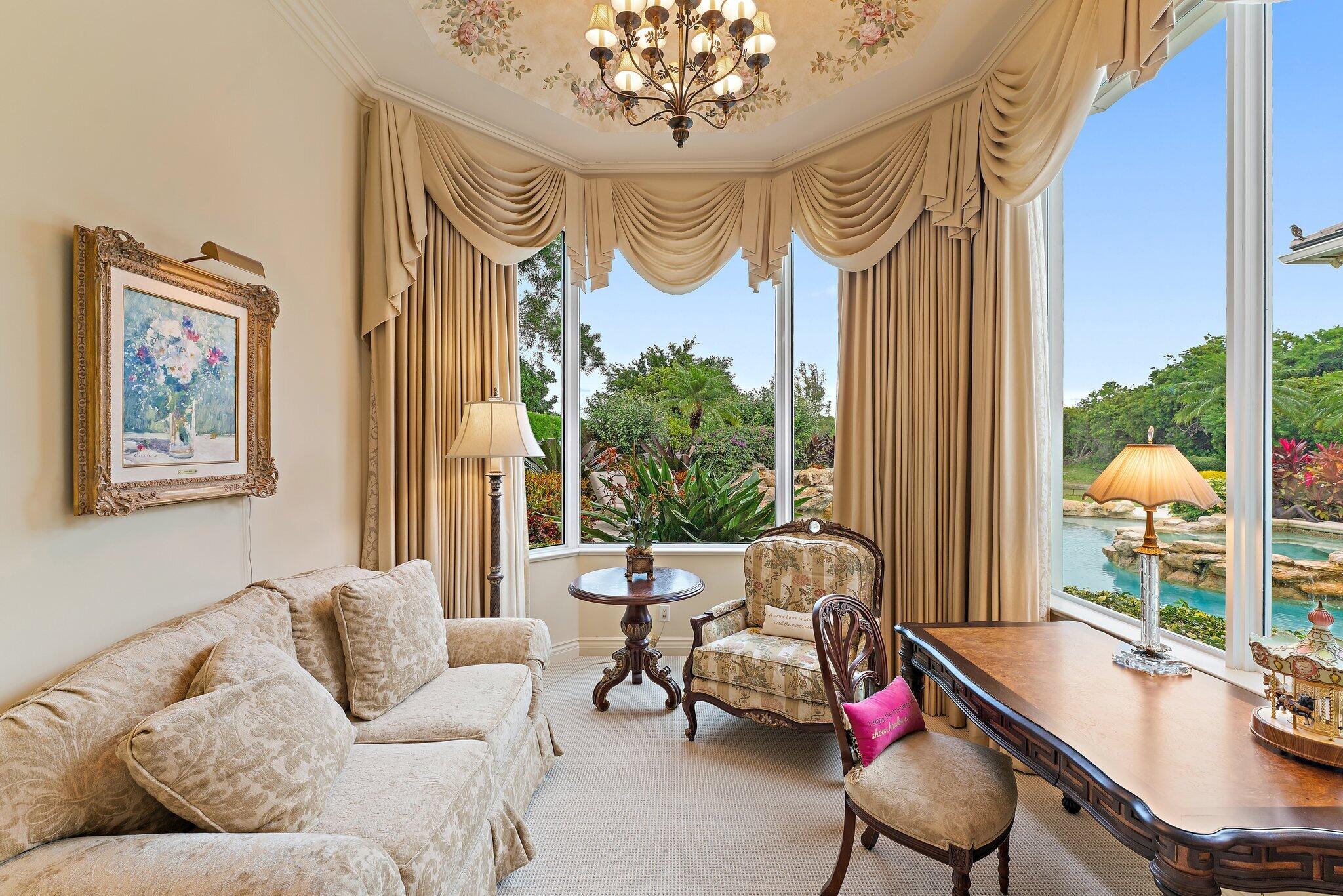 12049 Intercoastal Terrace Jupiter, FL 33469 - Photo 28 of 56 a living room with furniture and a large window