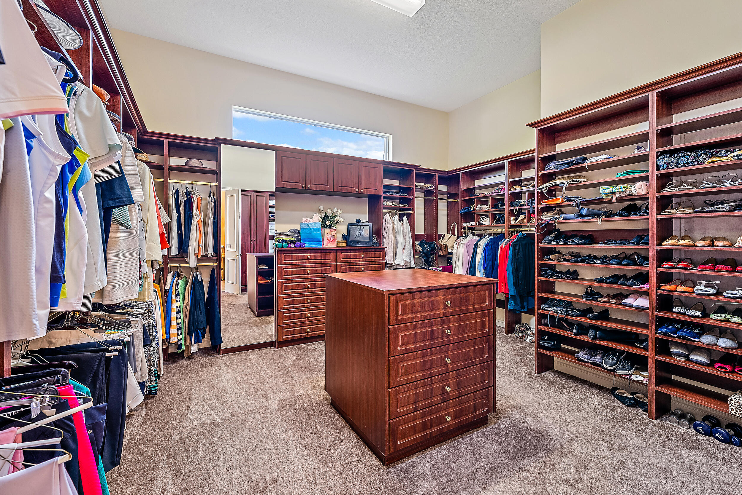 12049 Intercoastal Terrace Jupiter, FL 33469 - Photo 37 of 56 a view of walk in closet with clothes