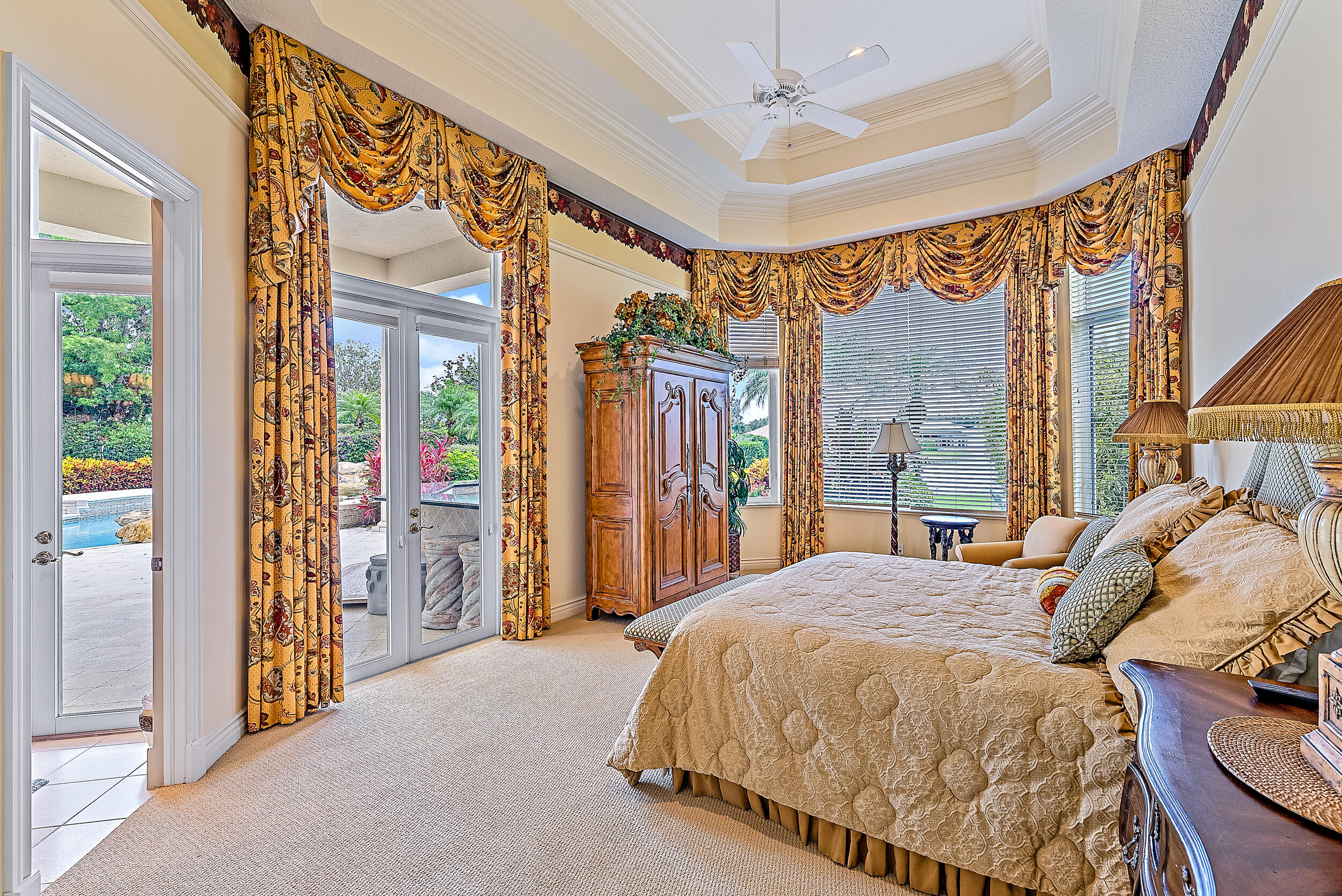 12049 Intercoastal Terrace Jupiter, FL 33469 - Photo 38 of 56 a bed sitting in a spacious bedroom next to a window