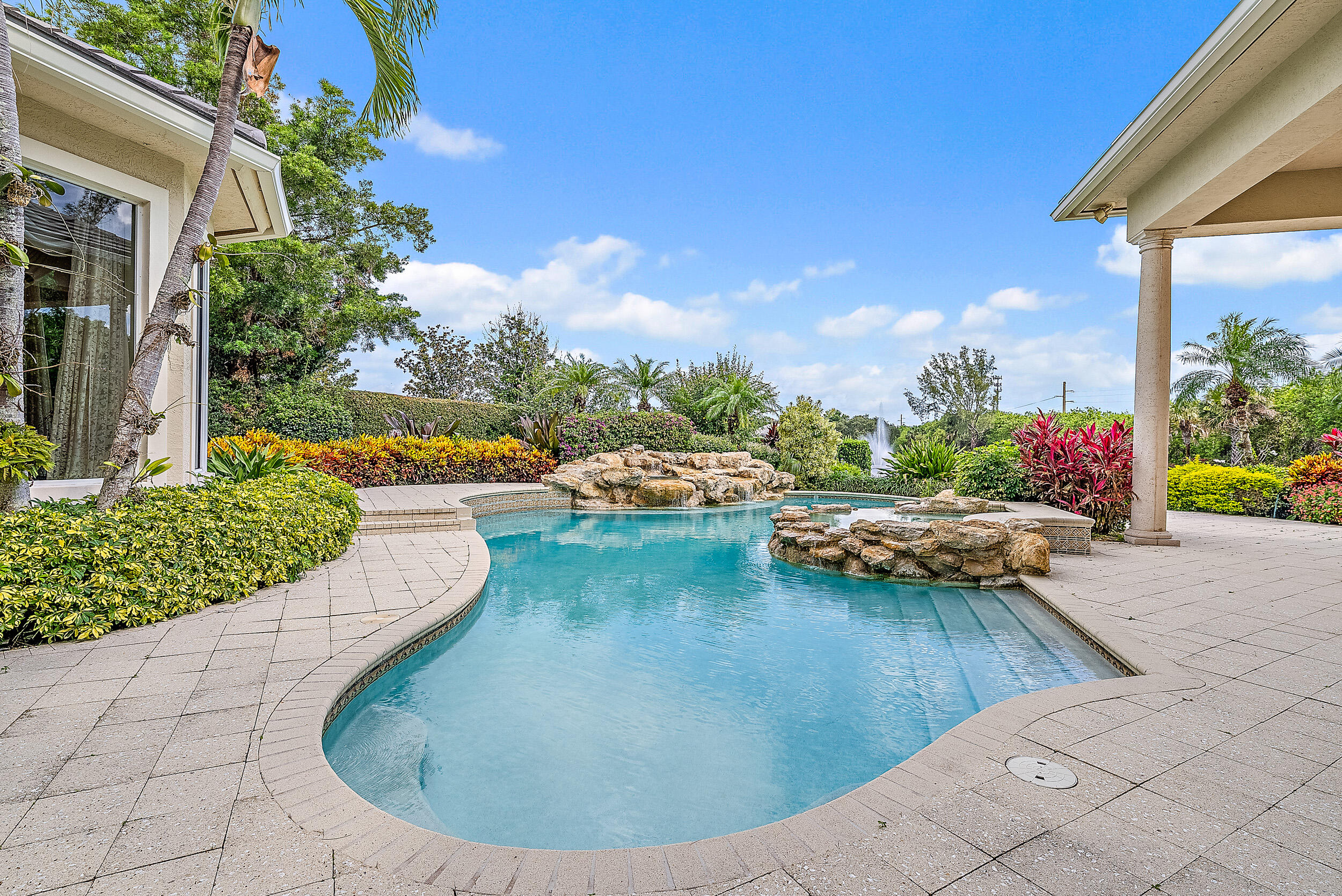 12049 Intercoastal Terrace Jupiter, FL 33469 - Photo 50 of 56 a view of a swimming pool with lounge chair
