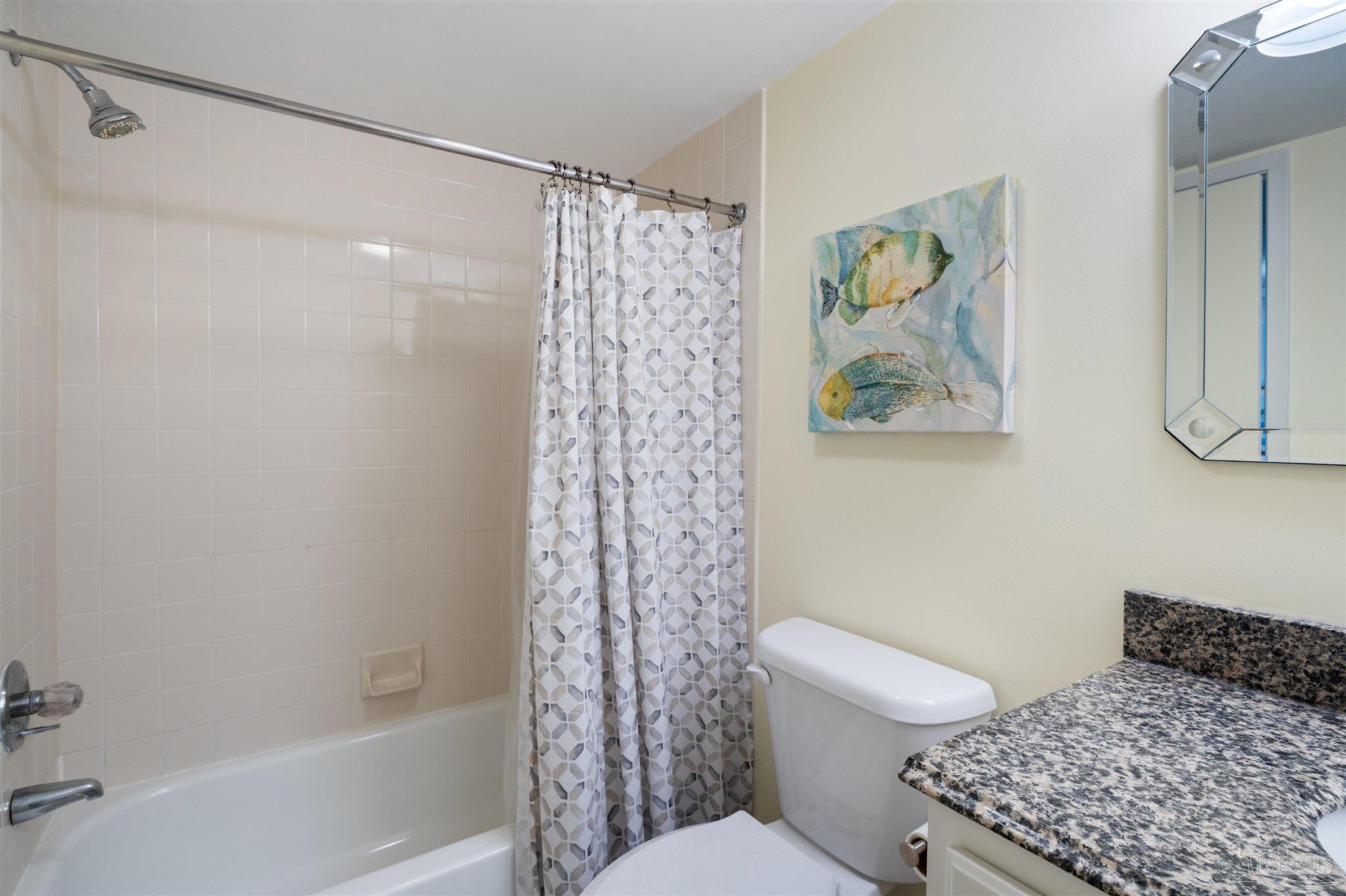 14100 River Road, Unit 228B Pensacola, FL 32507 - Photo 22 of 41 a bathroom with a toilet and a shower