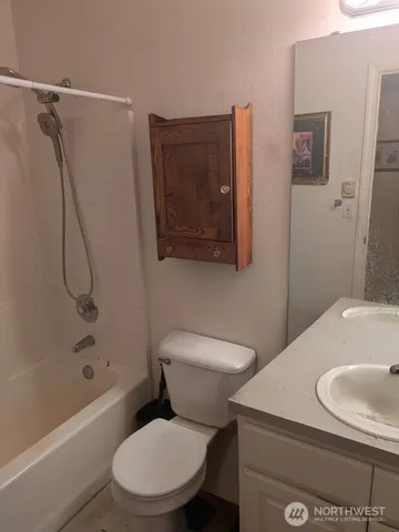 a view of a door and chair in the backyard