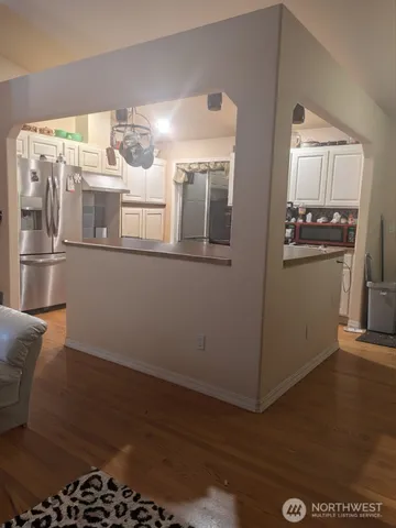a bathroom with a granite countertop bathtub and sink