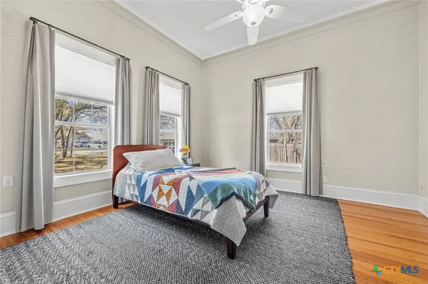 a front view of a house with swimming pool and porch