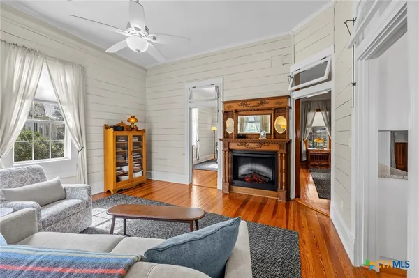 a living room with furniture and a fireplace